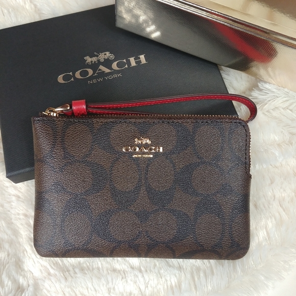 Coach Handbags - Coach Corner Zip Wrislet In Signature Canvas